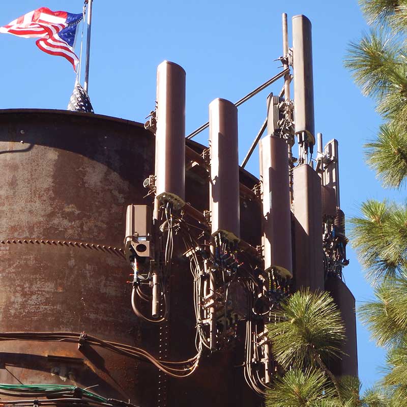 photo of communications equipment mounted to an old water tank