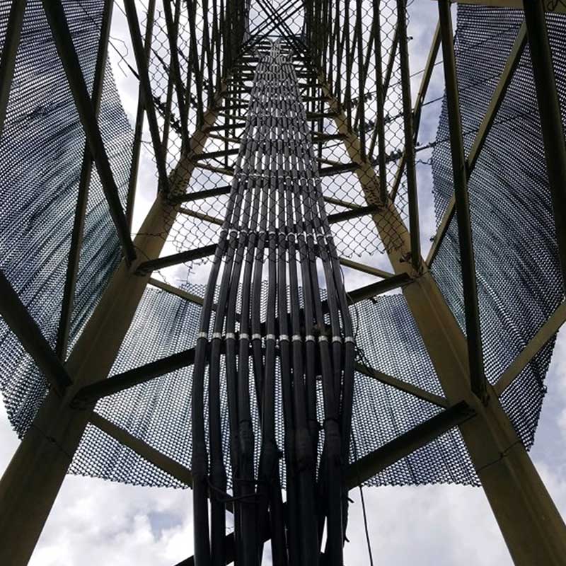 view of cables inside the framework of a tower