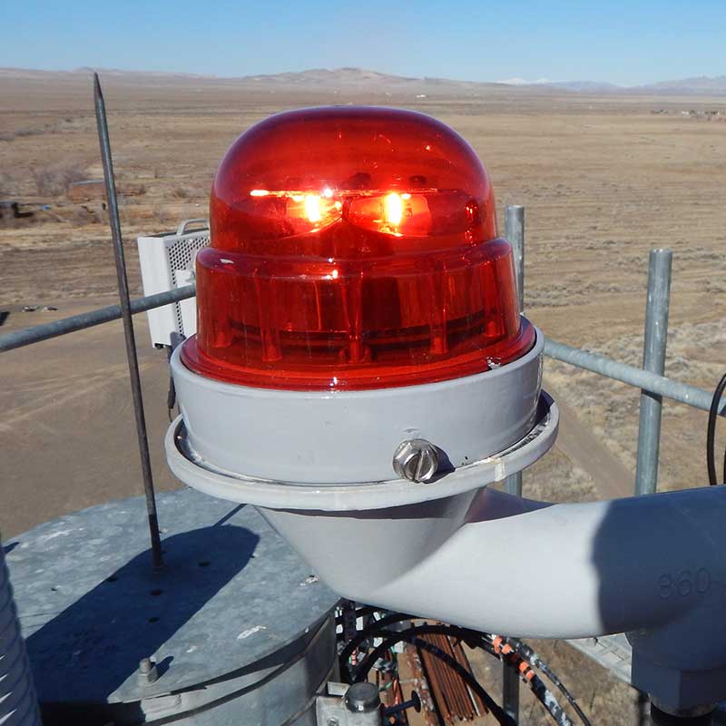 photo of red warning light on top of tower